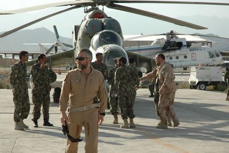 Pilots and ground personnel by the aircraft