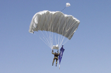 Paratrooper with a NATO flag