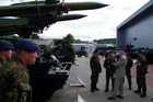 Visiting air defence personnel in front of their missiles