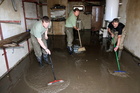 Soldiers clean a home