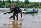 Rescuer pulls the "drowning" out of the water by the so called American way