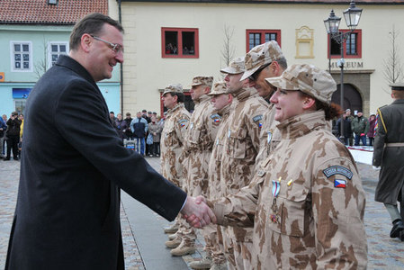 Petr Necas congratulates to one of awarded soldiers