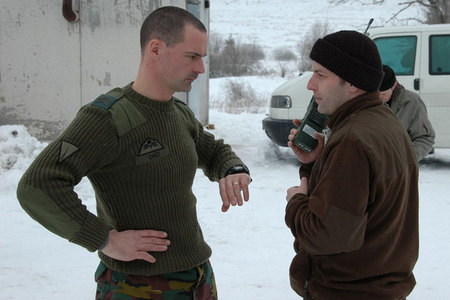 Czech First Lieutenant Jaroslav Pekarek (right) informs Belgian soldier about close air support by L-159 ALCA aircraft procedure