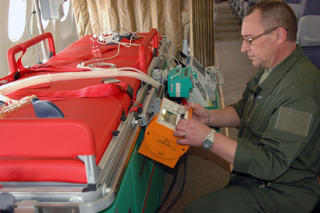 Bed is equipped with defibrillator, monitor of life functions and a breathing device